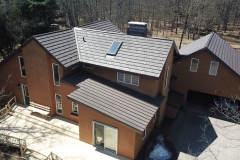 Rustic and Standing Seam Metal Roofing in Mustang Brown